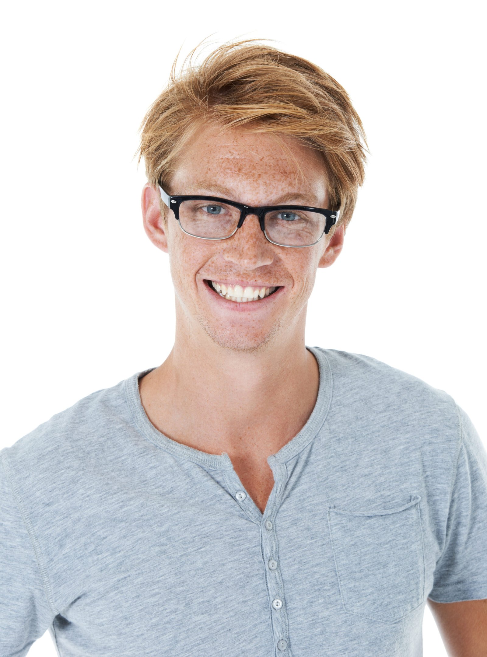 Portrait, happy and young man with glasses, confidence and smile from student style in studio. Eyewear, frames and ginger person from Australia with modern and casual fashion with white background.